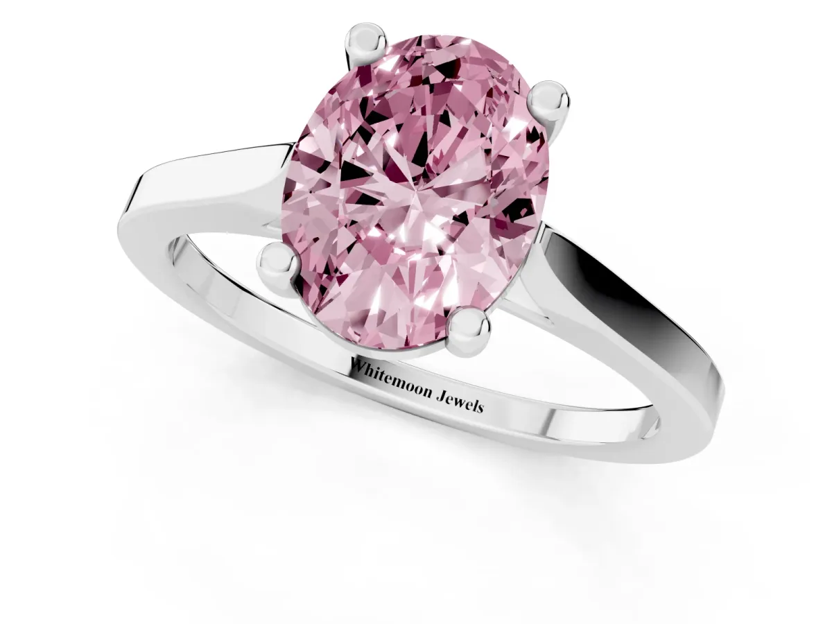 Fancy Pink Oval Cut Solitaire Diamond Ring with Four-Prong Setting and Tapered Band Platinum