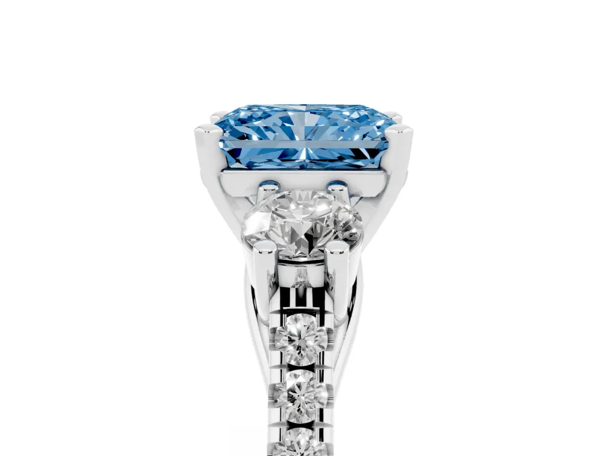Fancy Blue Three-Stone Radiant Cut Diamond Pavé Band with Four-Prong Setting Platinum