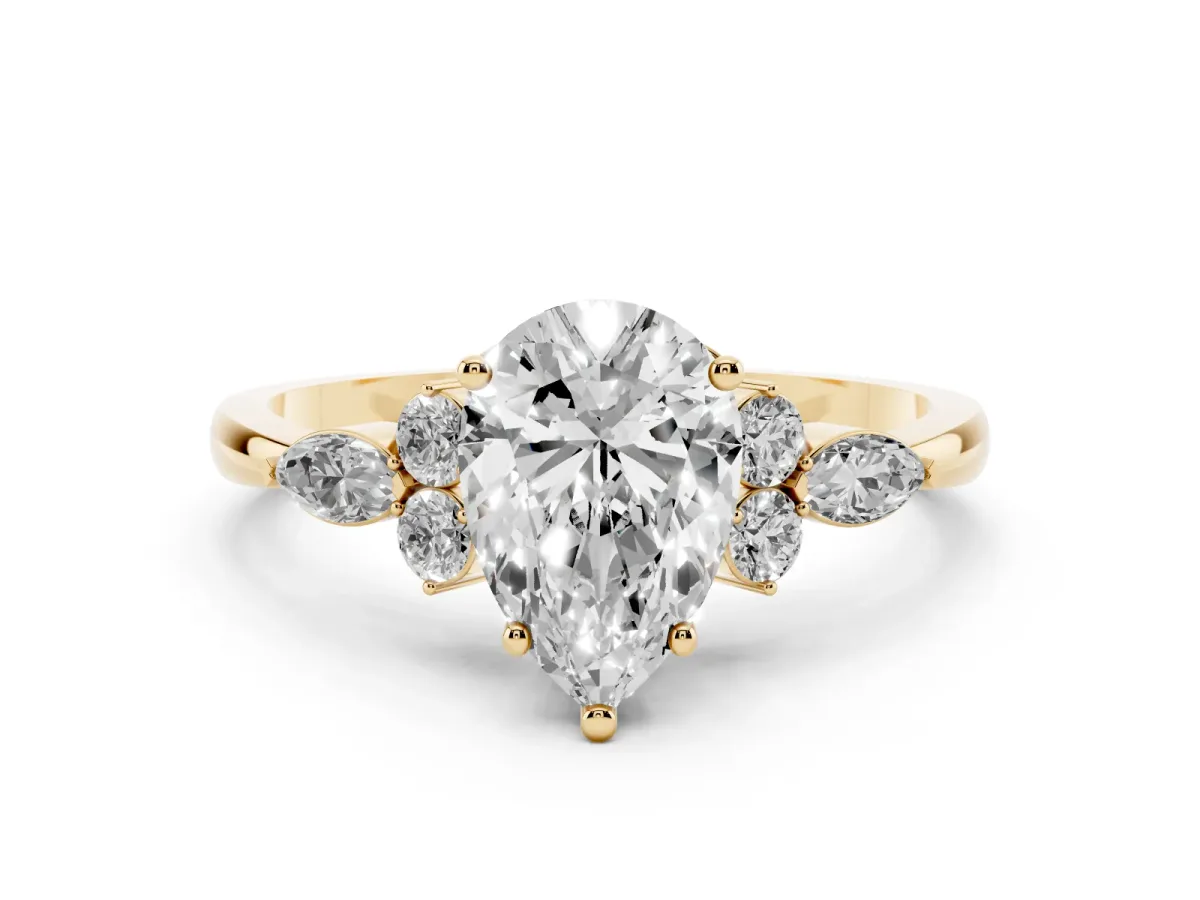 Pear Cut Brilliant Diamond Solitaire Ring with Pear Side Stones and Four-Prong Setting Yellow gold