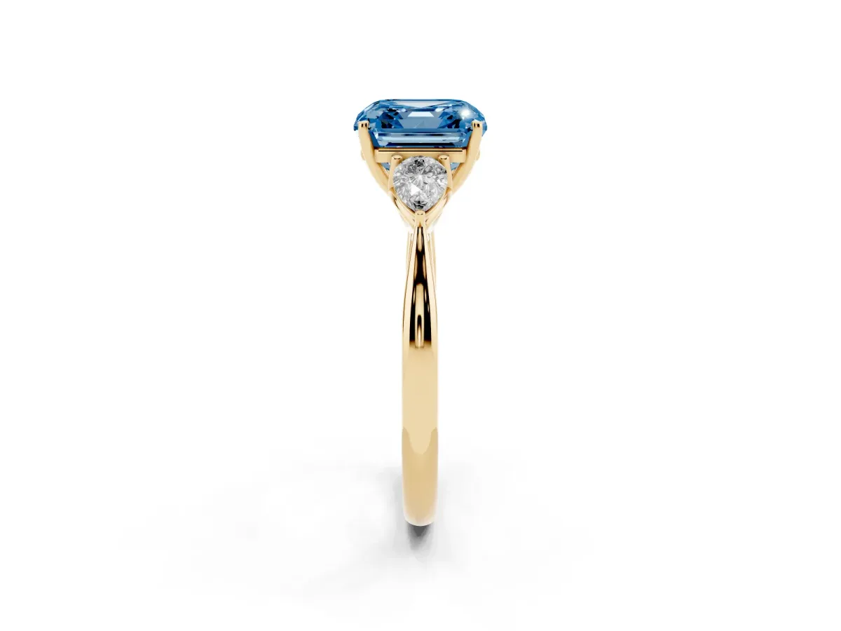 Fancy Blue Three-Stone Asscher Cut Brilliant Diamond Solitaire Ring with Tapered Band and Four-Prong Setting Yellow gold