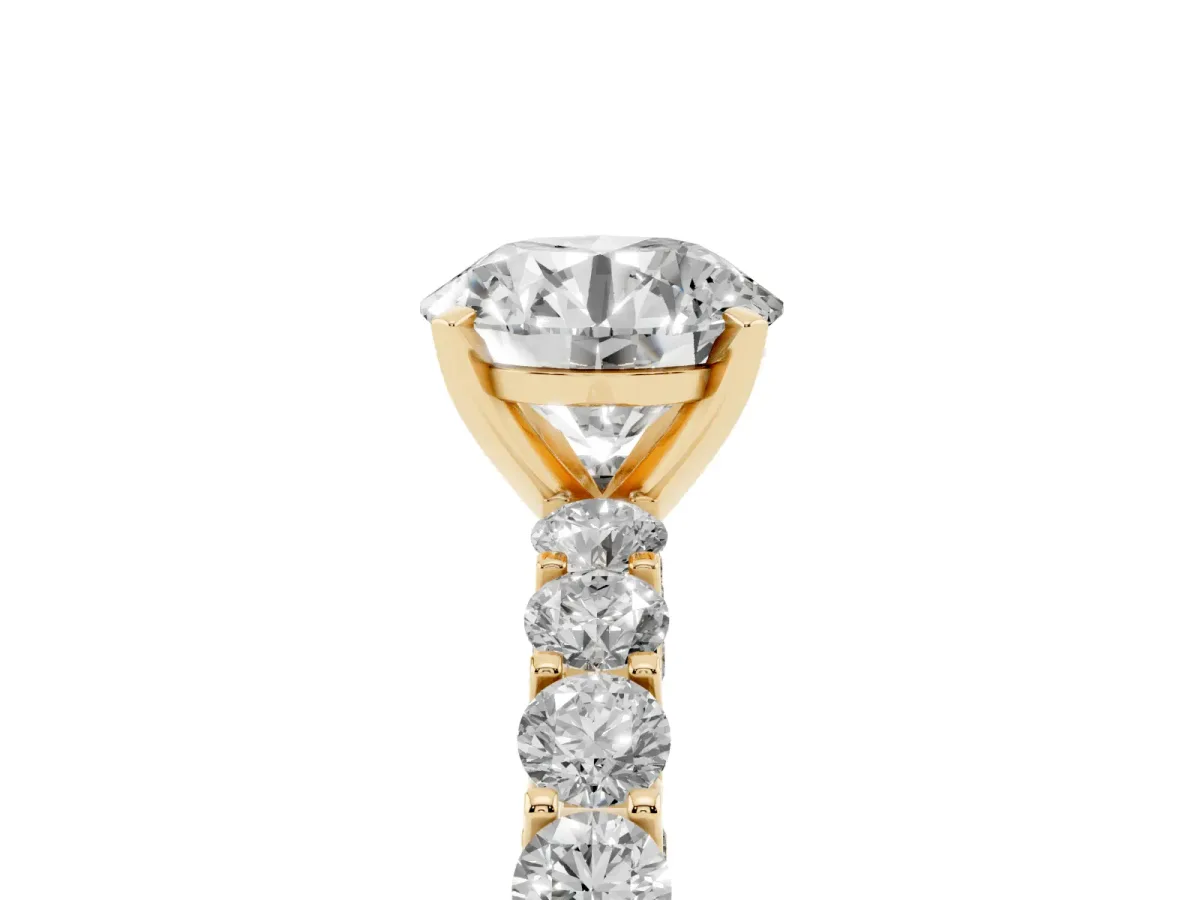 Round Cut Diamond Solitaire Ring with Shared Prong Pavé Band and Four-Prong Setting Yellow gold