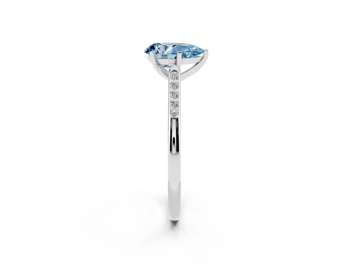 Fancy Blue Pear Cut Diamond Solitaire Ring with Channel Set Round Band and Prong Setting Silver
