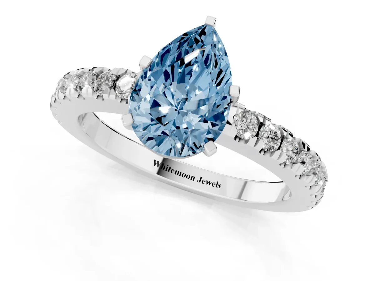 Fancy Blue Pear Cut Solitaire Diamond with Pavé Band and Four-Prong Setting Silver