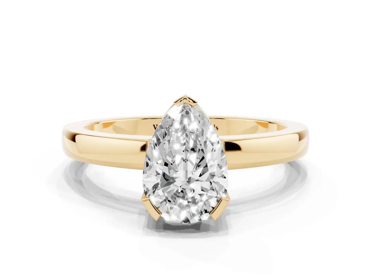 Pear Cut Cut Solitaire Ring with Four-Prong Setting and Classic Band Yellow gold