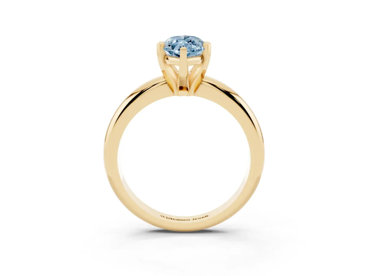 Fancy Blue Marquise Cut Diamond Solitaire Engagement Ring with Round Band and Four-Prong Setting Yellow gold