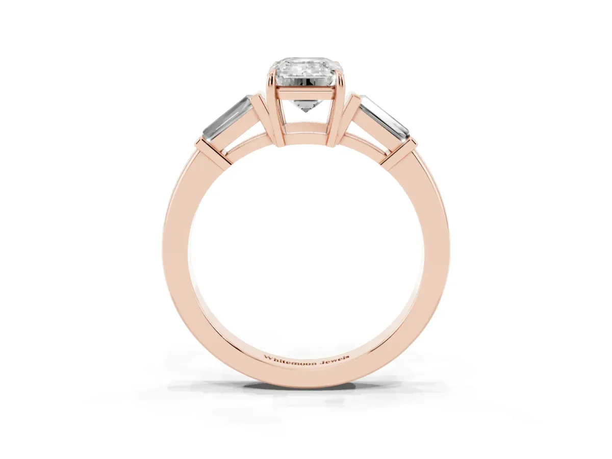 Emerald Cut Diamond Three-Stone Ring with Tapered Baguette Side Stones and Prong Setting Rose gold