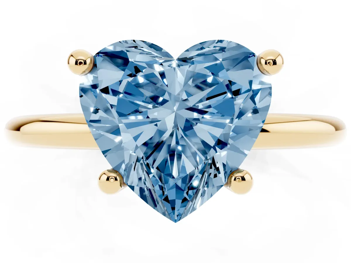 Fancy Blue Heart Cut Solitaire Diamond Ring with 4-Prong Setting on a Classic Band Yellow gold