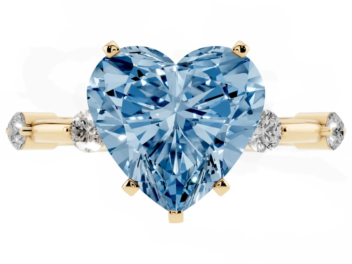 Fancy Blue Heart Cut Solitaire Diamond Ring with Bezel Set Side Stones and Prong Setting Yellow gold