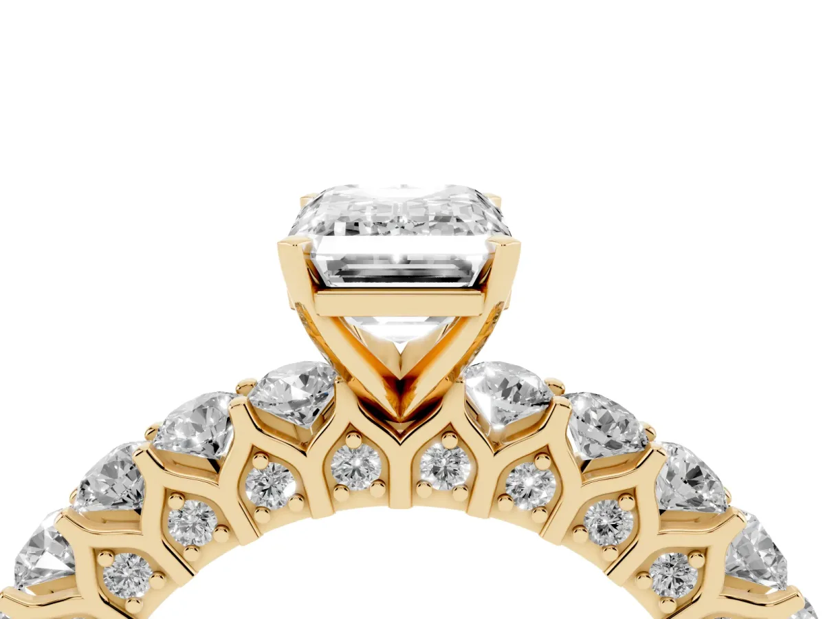 Emerald Cut Diamond Solitaire Ring with Shared Prong Pavé Band and Four-Prong Setting Yellow gold
