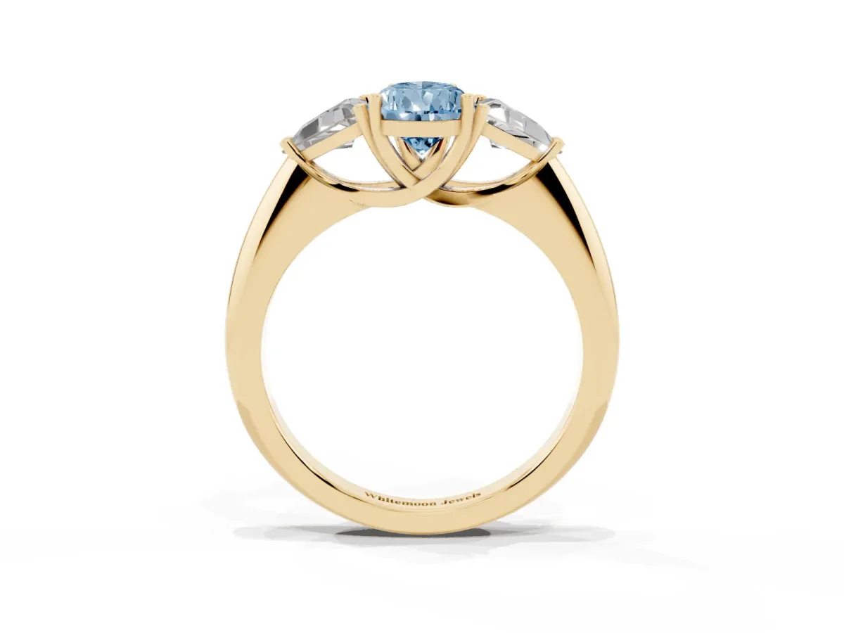 Fancy Blue Three-Stone Pear Cut Diamond Engagement Ring with Trillion Side Stones and Prong Setting Yellow gold