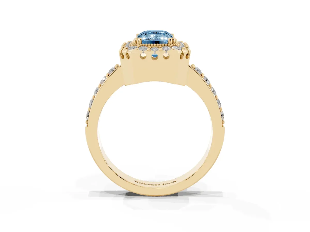 Fancy Blue Emerald Cut Diamond Halo Ring with Pavé Band and Prong Setting Yellow gold