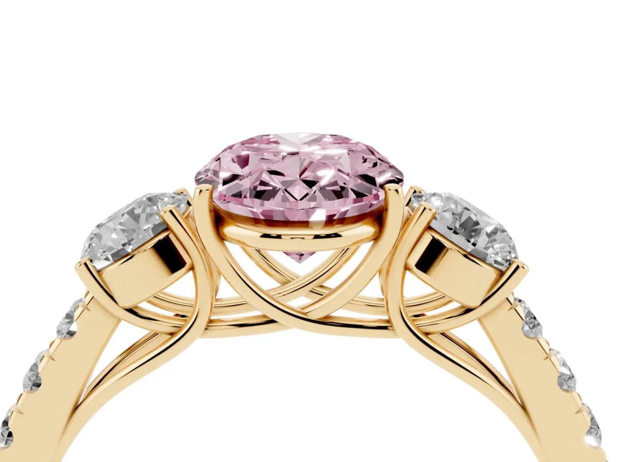 Fancy Pink Oval Cut Cut Diamond Three-Stone Ring with Round Side Stones and Pavé Band Yellow gold