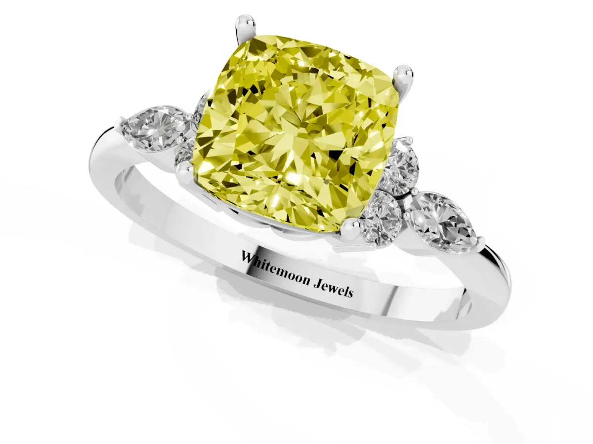 Fancy Yellow Cushion Cut Brilliant Diamond Solitaire Ring with Pear Side Stones and Four-Prong Setting Platinum