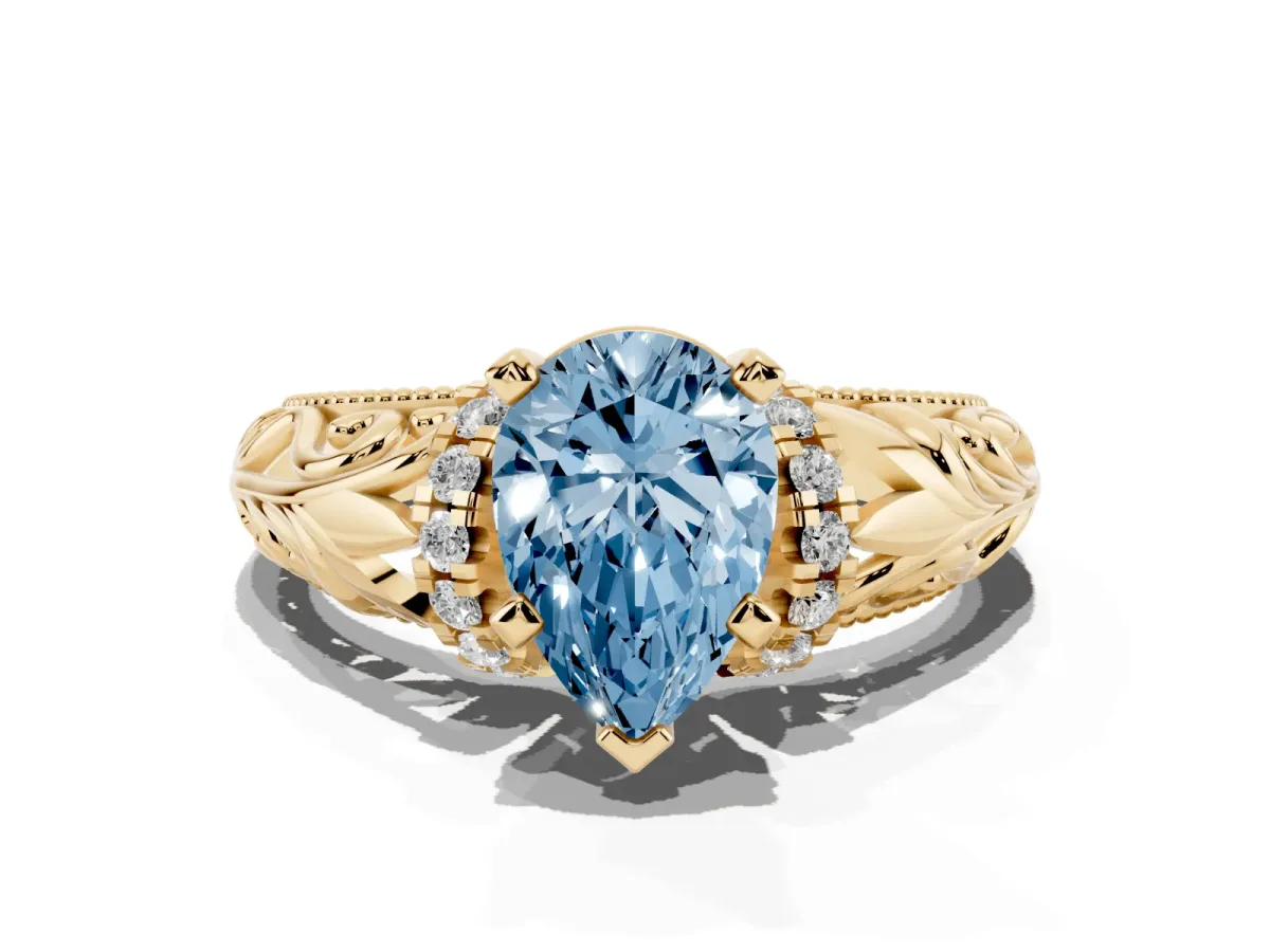 Fancy Blue Pear Cut Solitaire Filigree Engagement Ring with Halo and Prong Setting Yellow gold