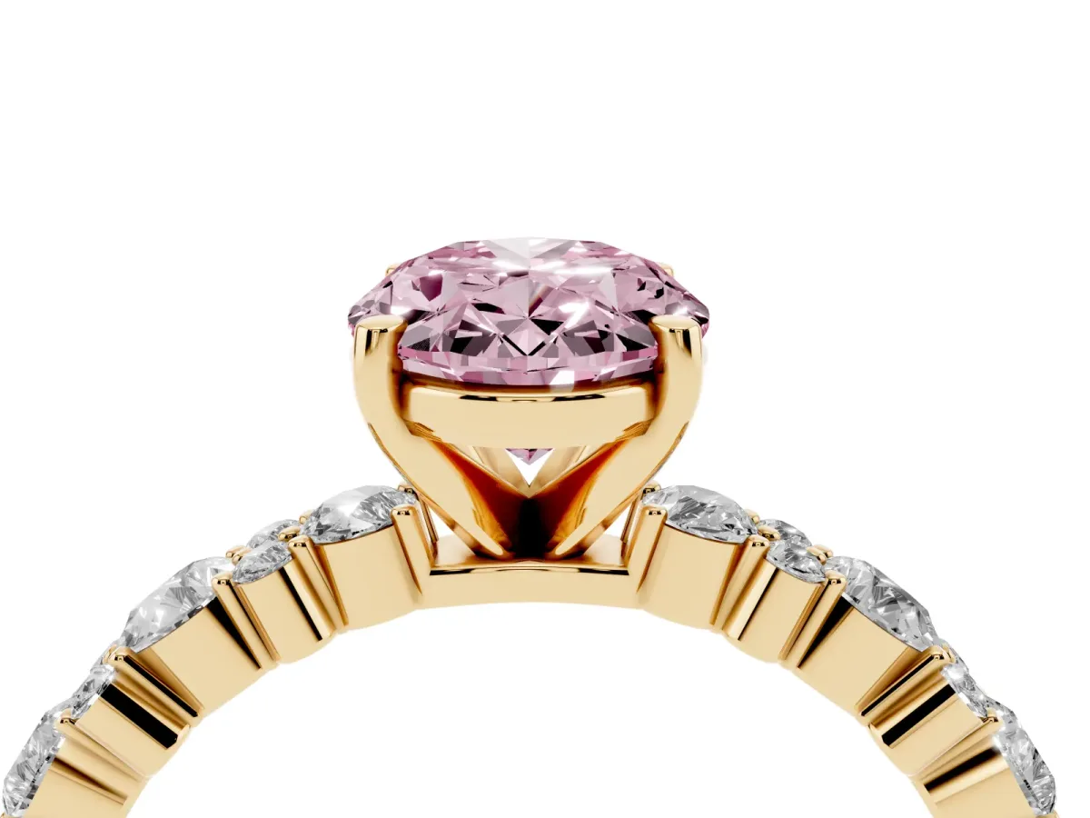 Fancy Pink Oval Cut Diamond Side Stone Solitaire Ring with Round and Four-Prong Setting Yellow gold