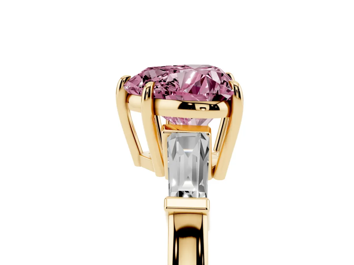 Fancy Pink Heart Cut Diamond Three-Stone Ring with Tapered Baguette Side Stones and Prong Setting Yellow gold