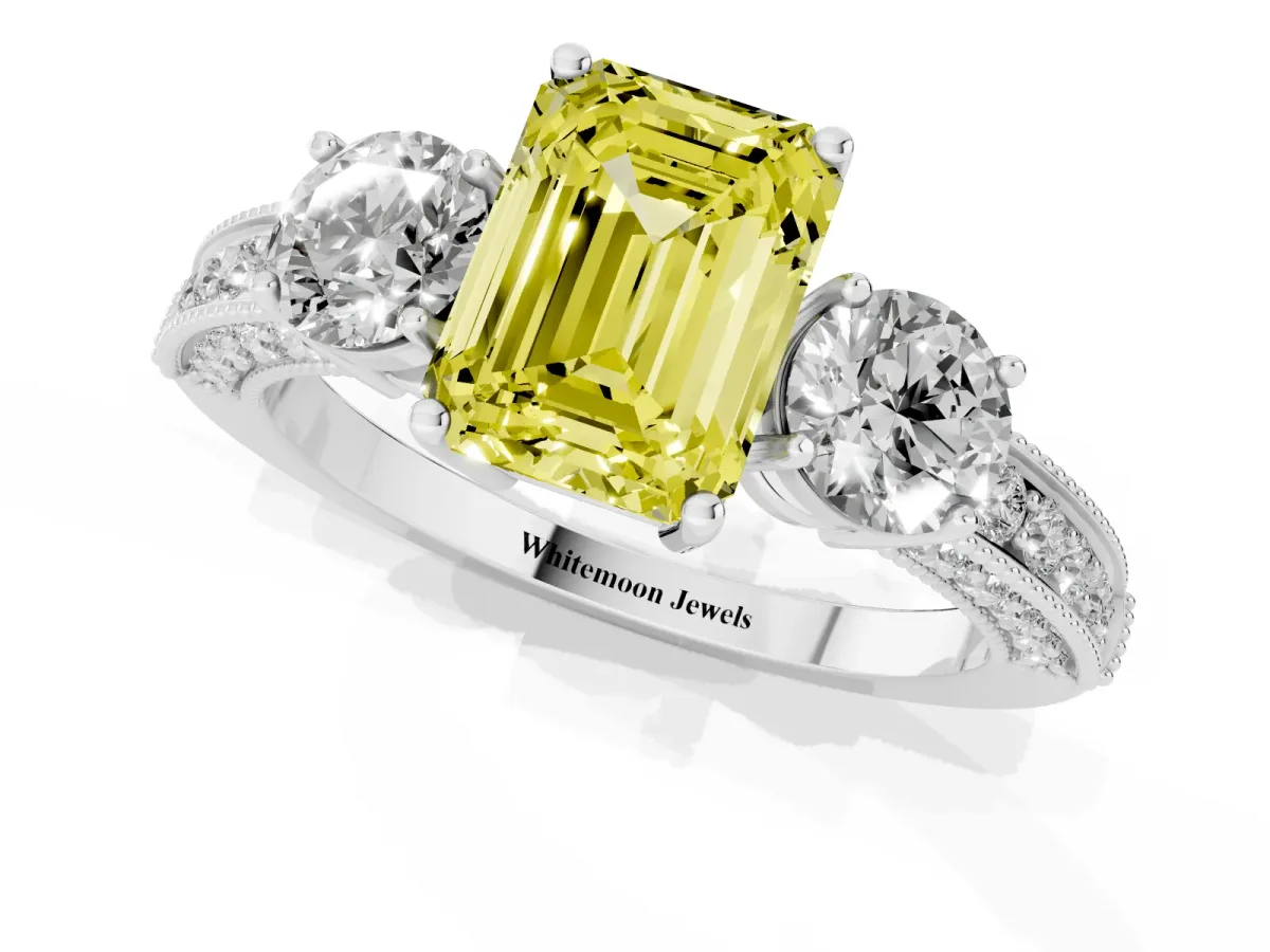 Fancy Yellow Emerald Cut Three-Stone Diamond Ring with Pavé Band and Four-Prong Setting Platinum