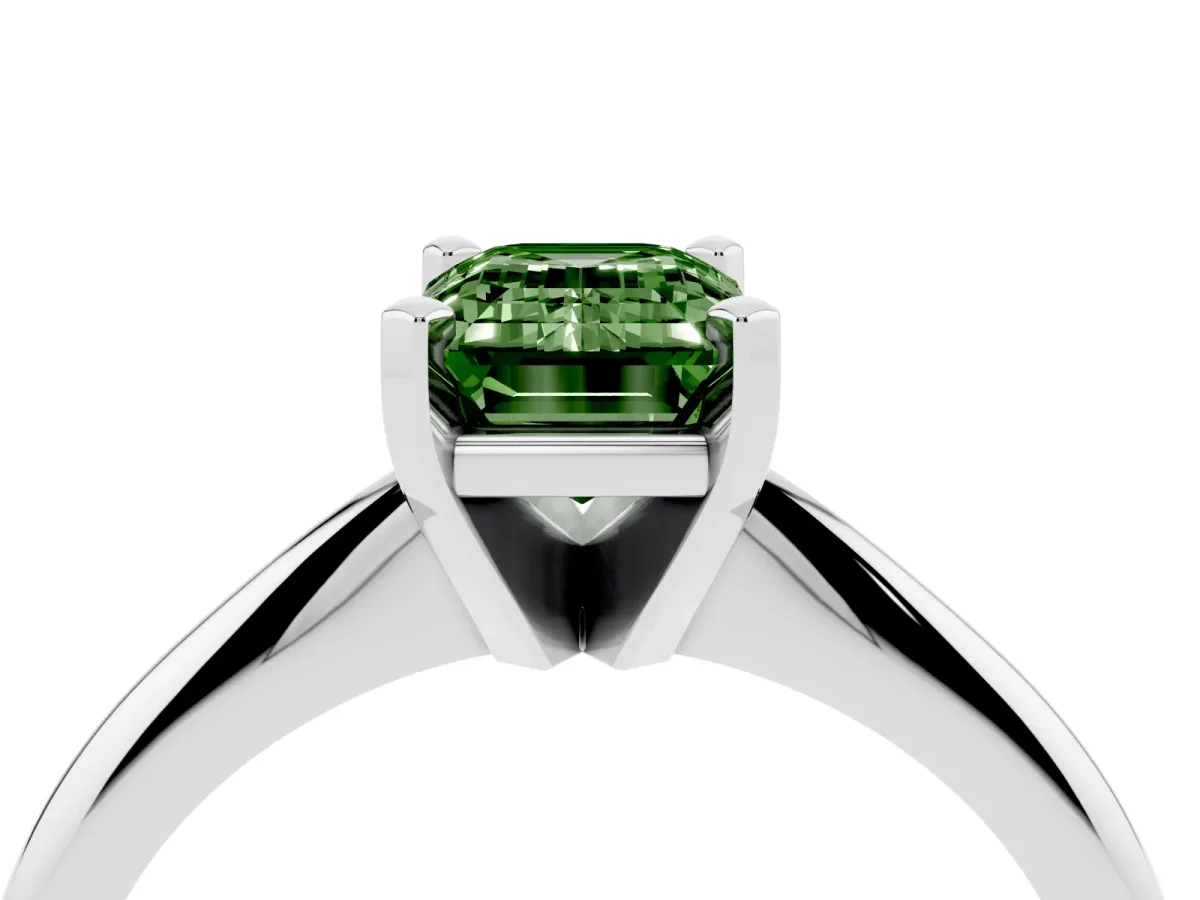 Fancy Green Emerald Cut Cut Solitaire Ring with Four-Prong Setting on a Classic Band Platinum