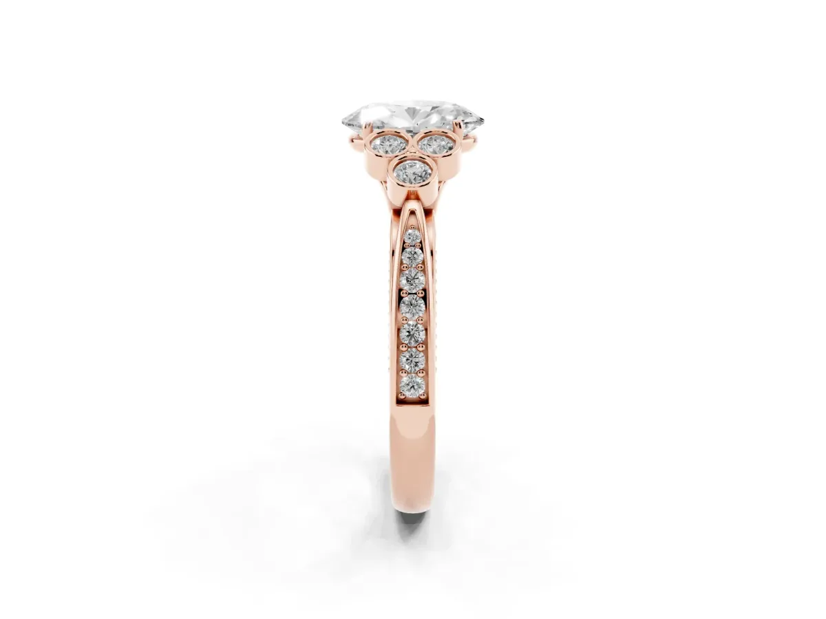 Oval Cut Cut Diamond Engagement Ring with Bezel Set Round Side Stones and Prong Setting Rose gold