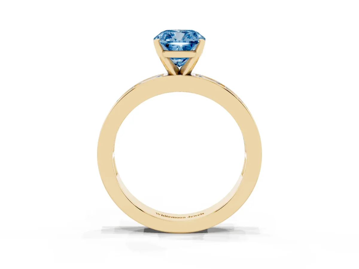 Fancy Blue Cushion Cut Solitaire Diamond Ring with Channel-Set Baguette Band and Four-Prong Setting Yellow gold