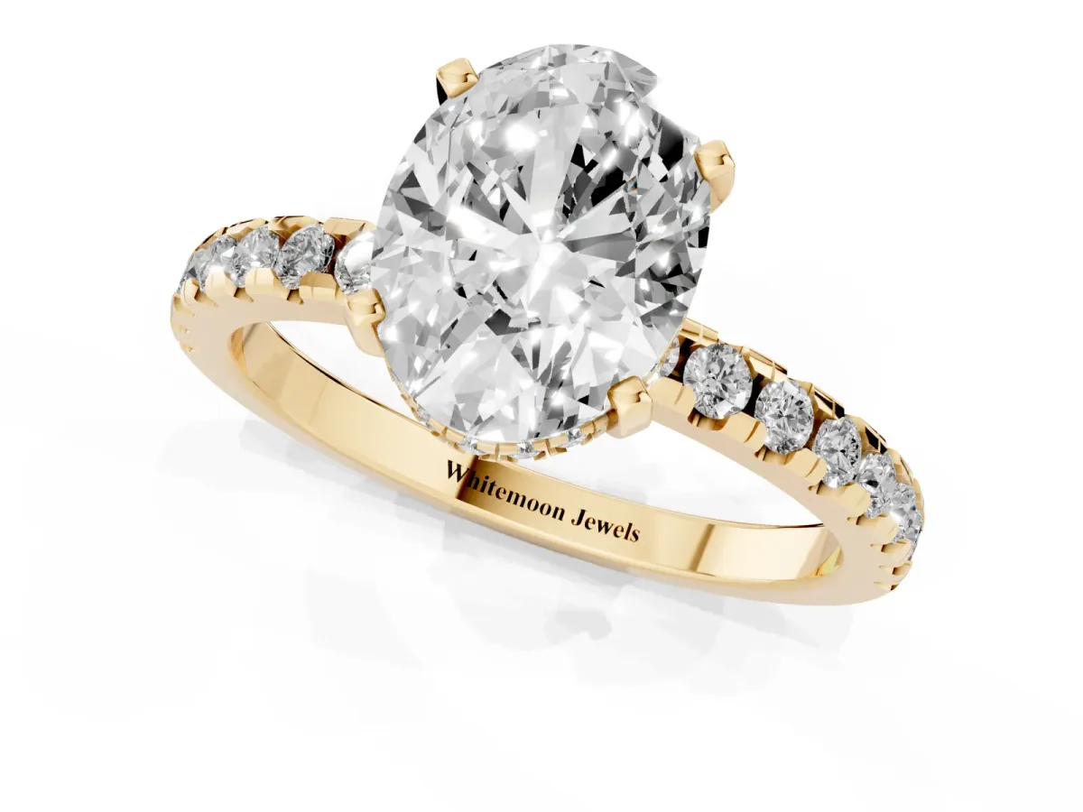 Oval Cut Diamond Solitaire Ring with Round Pavé Band and Four-Prong Setting Yellow gold
