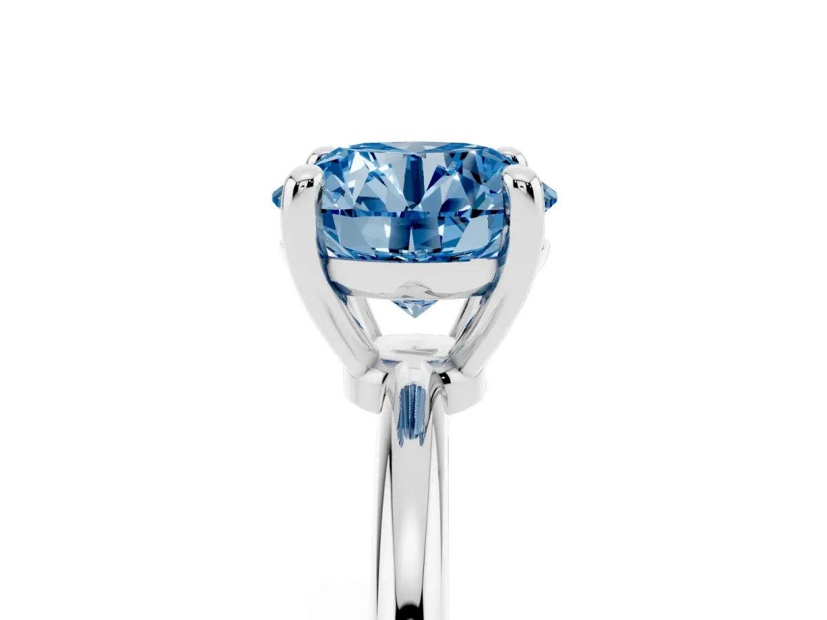 Fancy Blue Round Cut Solitaire Diamond Ring with 4-Prong Setting on a Classic Band Silver