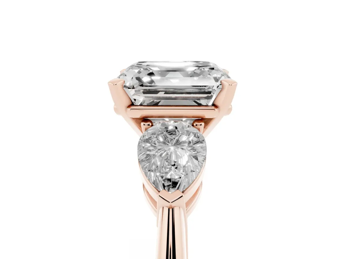 Three-Stone Asscher Cut Diamond Ring with Pear Side Stones and Four-Prong Setting Rose gold