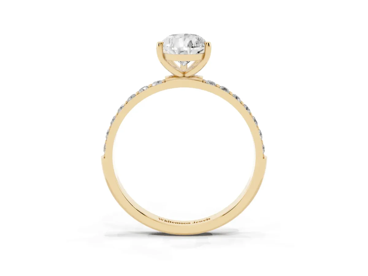 Pear Cut Diamond Solitaire Ring with Round Pavé Shoulders and Prong Setting Yellow gold