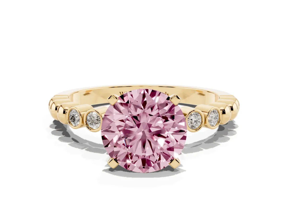 Fancy Pink Round Cut Solitaire Bezel Accent Diamond Engagement Ring with Beaded Band and Four-Prong Setting Yellow gold