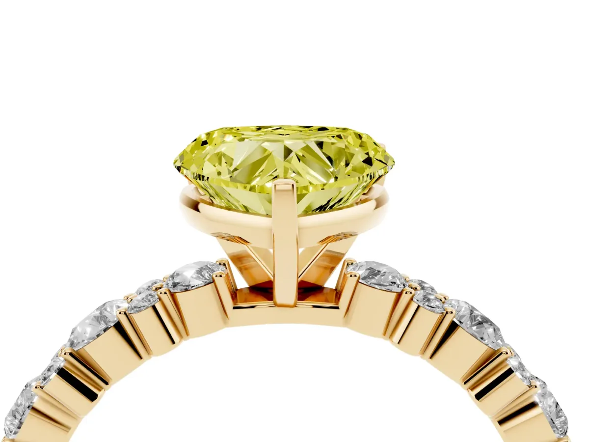 Fancy Yellow Heart Cut Diamond Side Stone Solitaire Ring with Round and Four-Prong Setting Yellow gold
