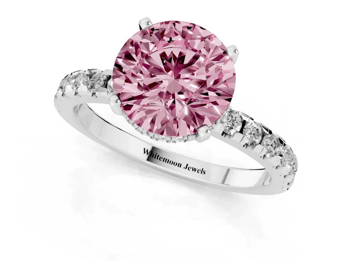 Fancy Pink Round Cut Diamond Solitaire Ring with Round Pavé Band and Four-Prong Setting Silver
