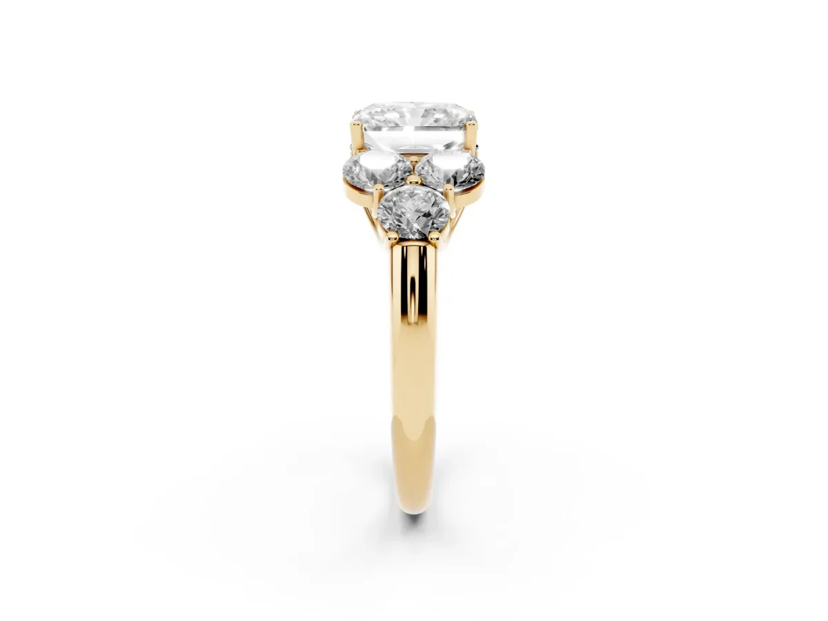 Radiant Cut Cut Diamond Cluster Ring with Round Accent Stones and Prong Setting on a Classic Band Yellow gold
