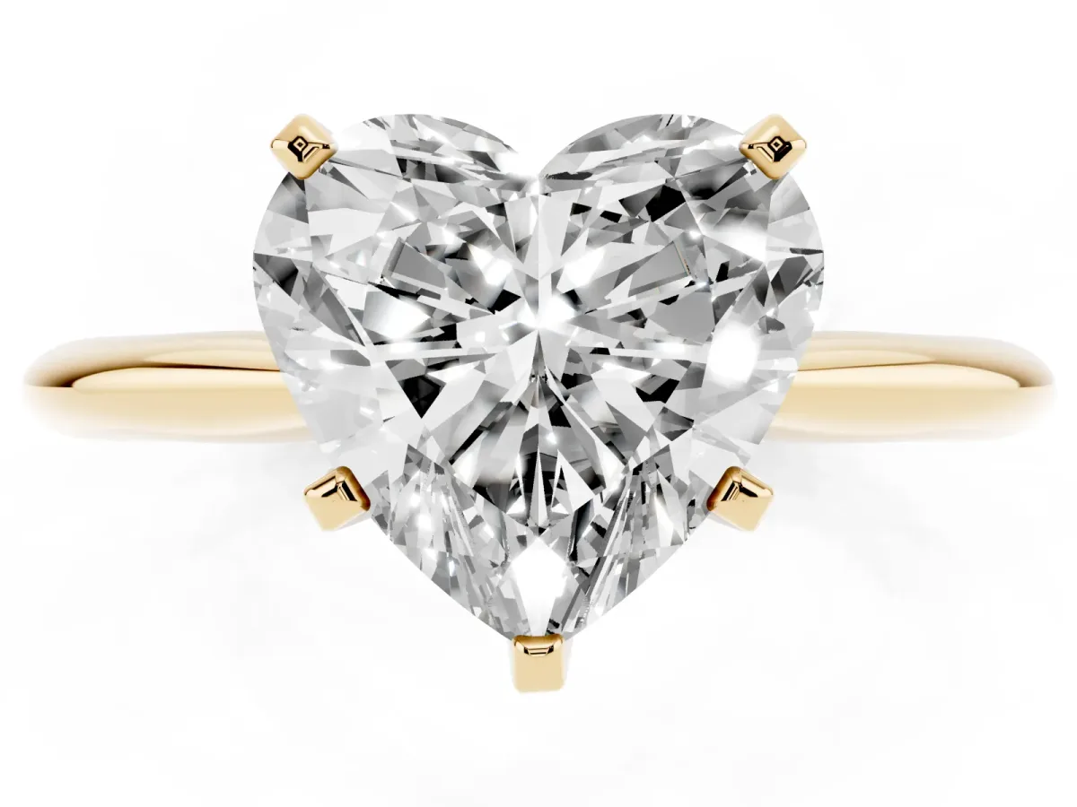 Heart Cut Cut Solitaire Ring with Four-Prong Setting on a Classic Band Yellow gold