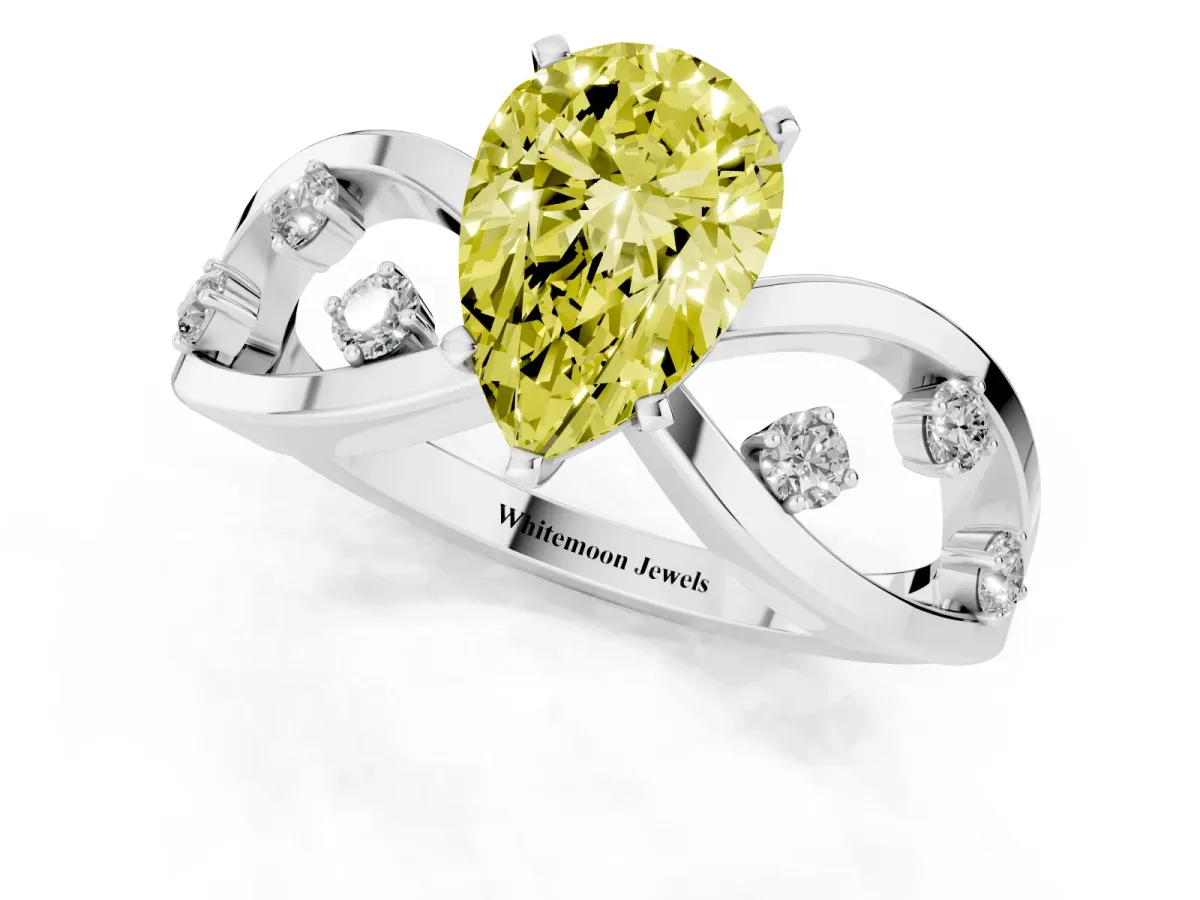 Fancy Yellow Pear Cut Cut Solitaire Diamond with Side Stones on Criss-Cross Band and Four-Prong Setting Silver