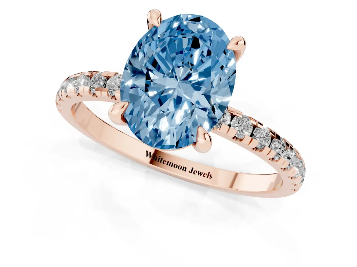 Fancy Blue Oval Cut Diamond Brilliant Solitaire Ring with Pavé Band and Four-Prong Setting Rose gold