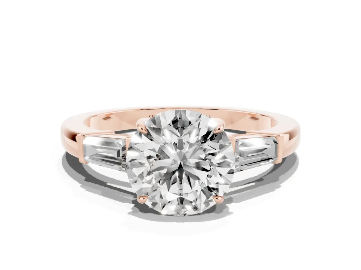 Round Cut Diamond Three-Stone Ring with Tapered Baguette Side Stones and Prong Setting Rose gold