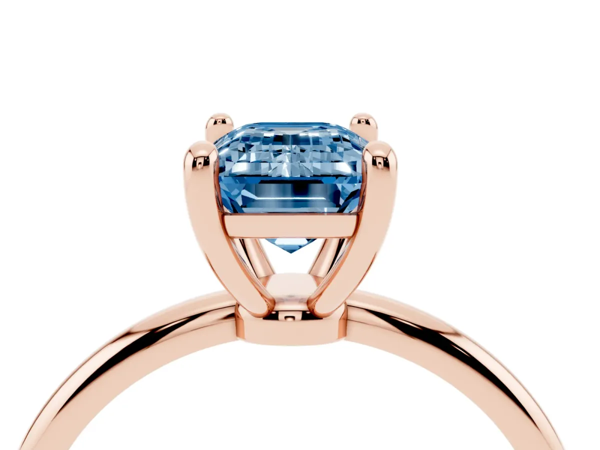 Fancy Blue Emerald Cut Solitaire Diamond Ring with 4-Prong Setting on a Classic Band Rose gold