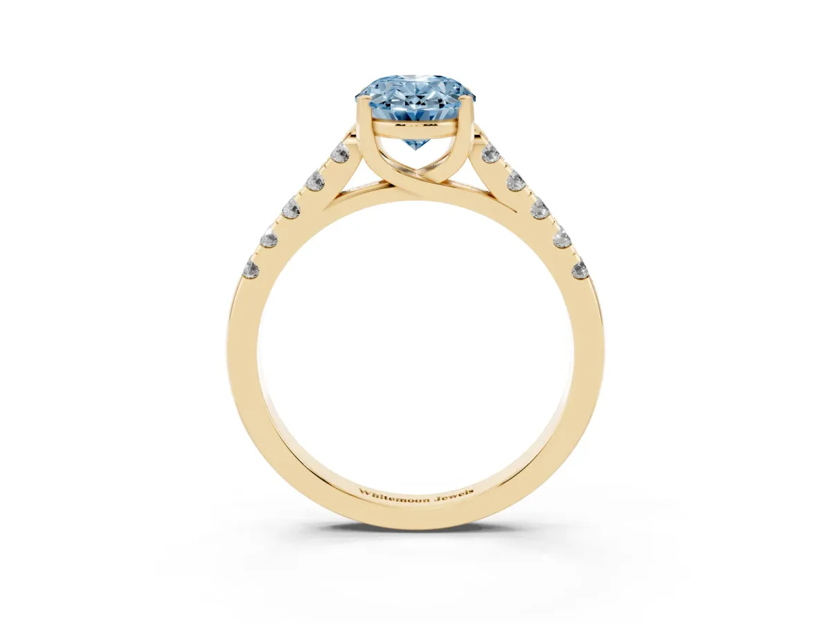 Fancy Blue Oval Cut Diamond Pavé Band Solitaire Ring with Prong Setting Yellow gold