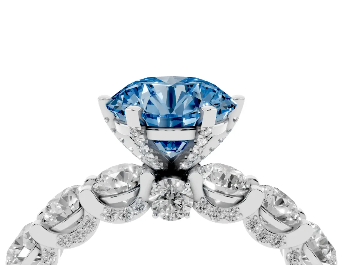 Fancy Blue Round Cut Diamond Side Stone Engagement Ring with Four-Prong Setting Silver