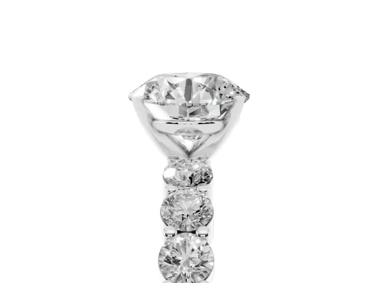 Round Cut Diamond Solitaire Ring with Shared Prong Round Side Stones Silver
