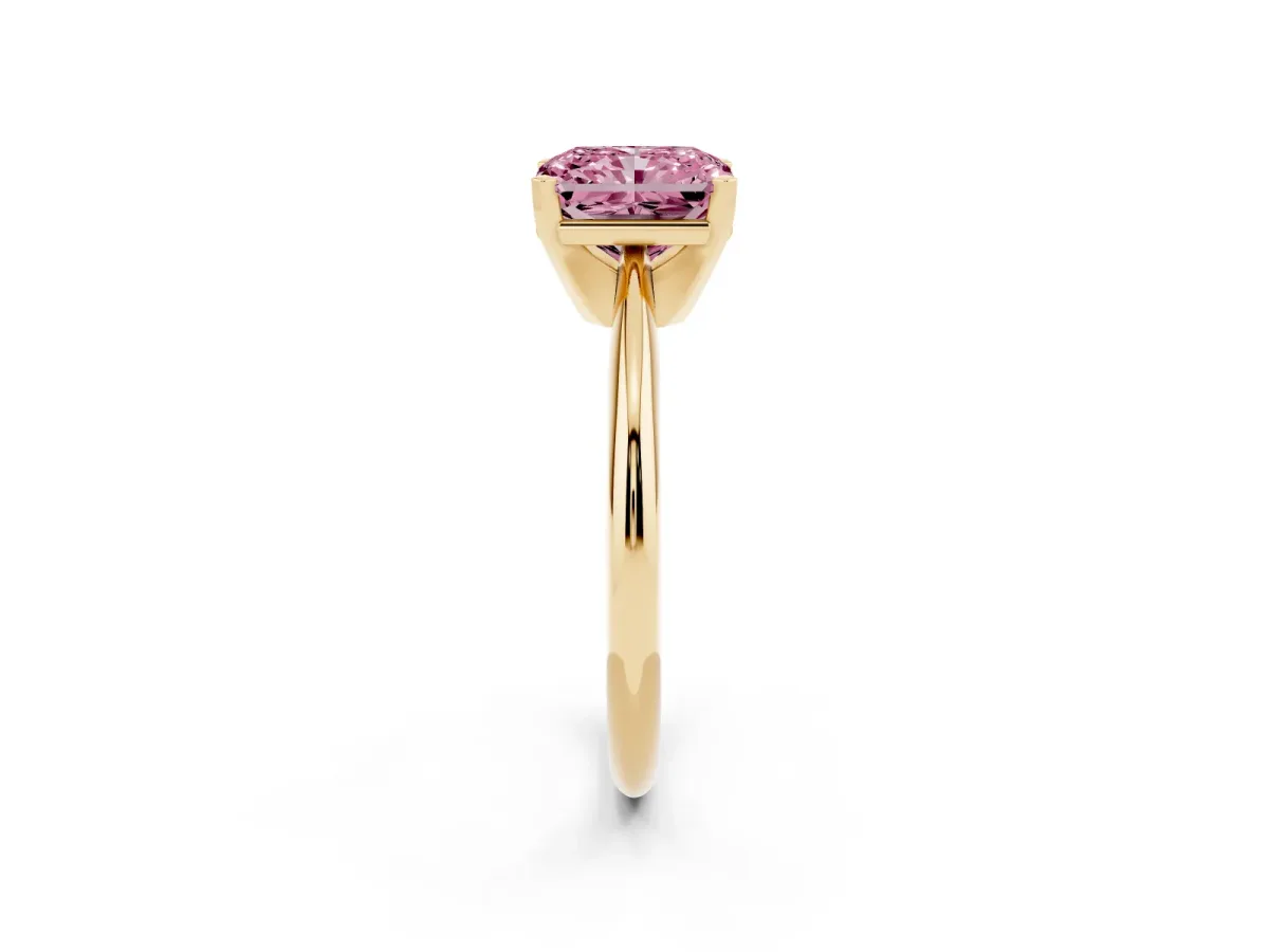 Fancy Pink Radiant Cut Cut Solitaire Ring with Four-Prong Setting on a Classic Band Yellow gold