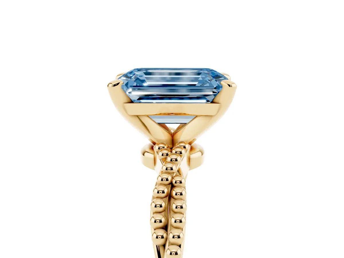 Fancy Blue Emerald Cut Solitaire Twisted Band with Bead Prong Setting Yellow gold