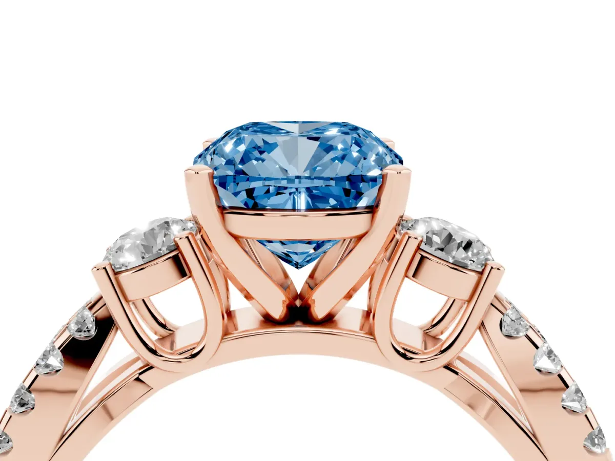 Fancy Blue Cushion Cut Diamond Three-Stone Ring with Pavé Split Shank and Four-Prong Setting Rose gold