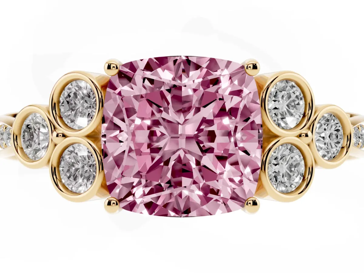 Fancy Pink Cushion Cut Cut Diamond Engagement Ring with Bezel Set Round Side Stones and Prong Setting Yellow gold