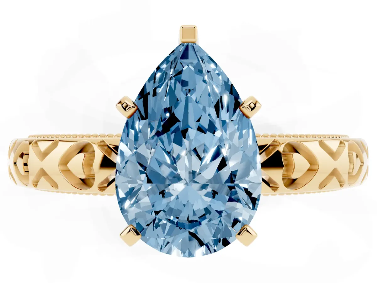 Fancy Blue Pear Cut Solitaire Diamond Engagement Ring with XO Engraved Band and Four-Prong Setting Yellow gold