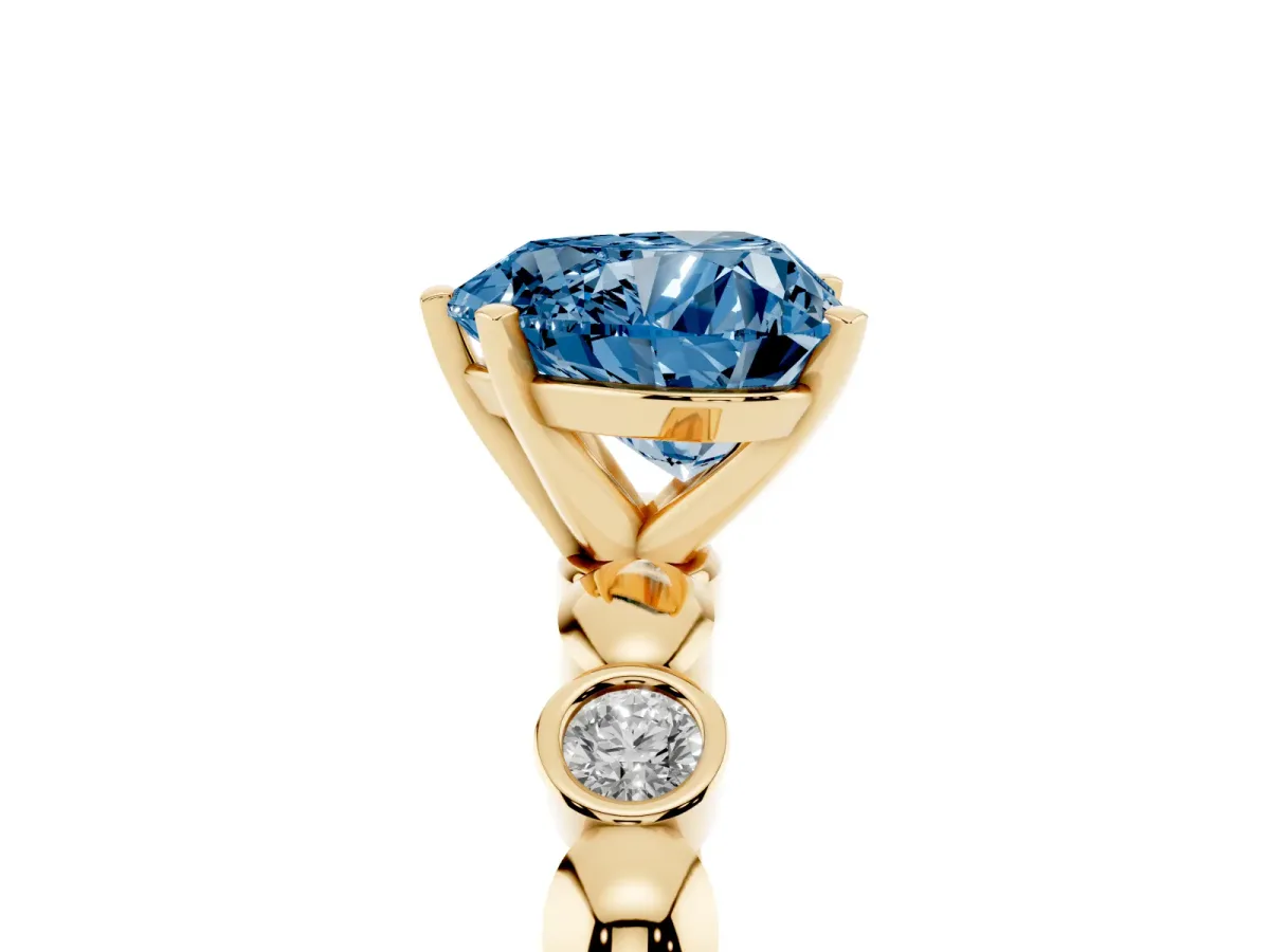Fancy Blue Heart Cut Solitaire Bezel-Set Diamond Ring with Beaded Band and Four-Prong Setting Yellow gold