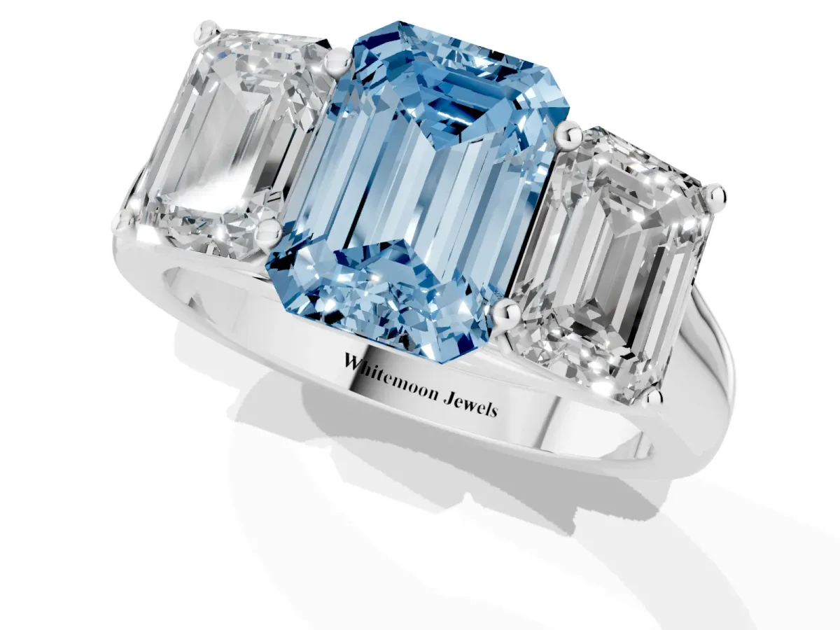 Fancy Blue Emerald Cut Three-Stone Diamond Ring with Prong Setting on a Classic Band Silver