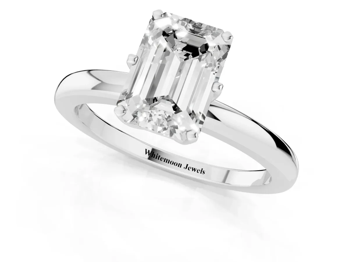 Emerald Cut Solitaire Diamond Ring with Six-Prong Setting on a Classic Band Silver