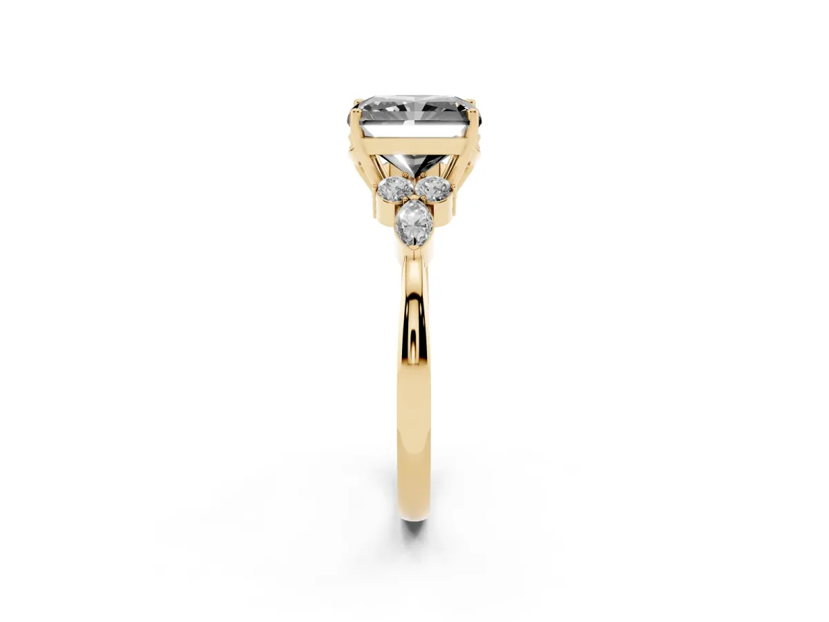 Fancy Black Radiant Cut Brilliant Diamond Solitaire Ring with Pear Side Stones and Four-Prong Setting Yellow gold