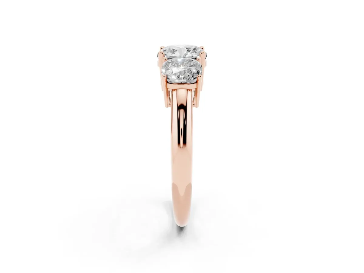 Three-Stone Cushion Cut Cut Diamond Engagement Ring with Prong Setting on a White Gold Band Rose gold